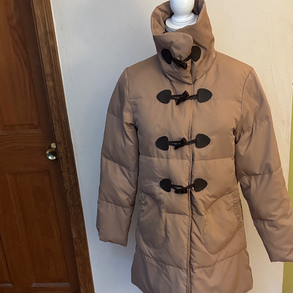 Stylish Tan Puffer Coat with Black Toggles.  Full zipper.